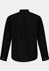 Camicia nera a maniche lunghe con collo classico, piega sul retro e polsini abbottonati. Realizzata in tessuto liscio, presenta un colore uniforme senza fantasie.
