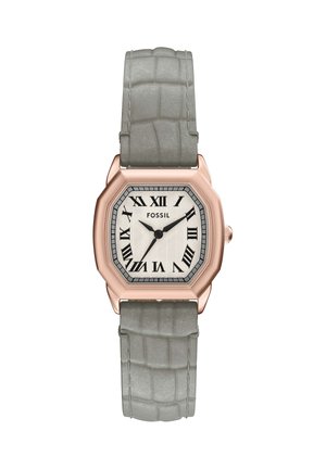 Orologio quadrato in oro rosa con quadrante bianco, numeri romani neri e cinturino in pelle grigia texturizzata che mostra l'ora 7:09.