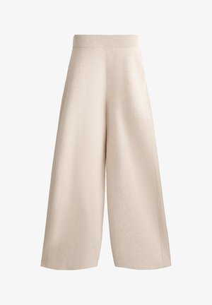 Beige vida byxor med ribbad midja, texturerat tyg och vertikala veck längs sidorna för extra detaljer.