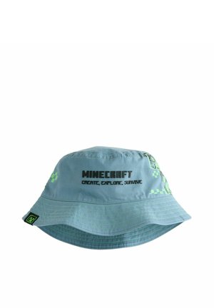 Svetlomodrá vedierková čiapka Minecraft so zelenými pixelovými vzormi a čiernym textom "Minecraft Create, Explore, Survive" na prednej strane.