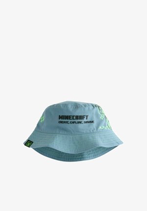 Sombrero tipo cubo de Minecraft de color azul claro con diseños de píxeles verdes y texto negro que dice "Minecraft Crear, Explorar, Sobrevivir" en la parte frontal.