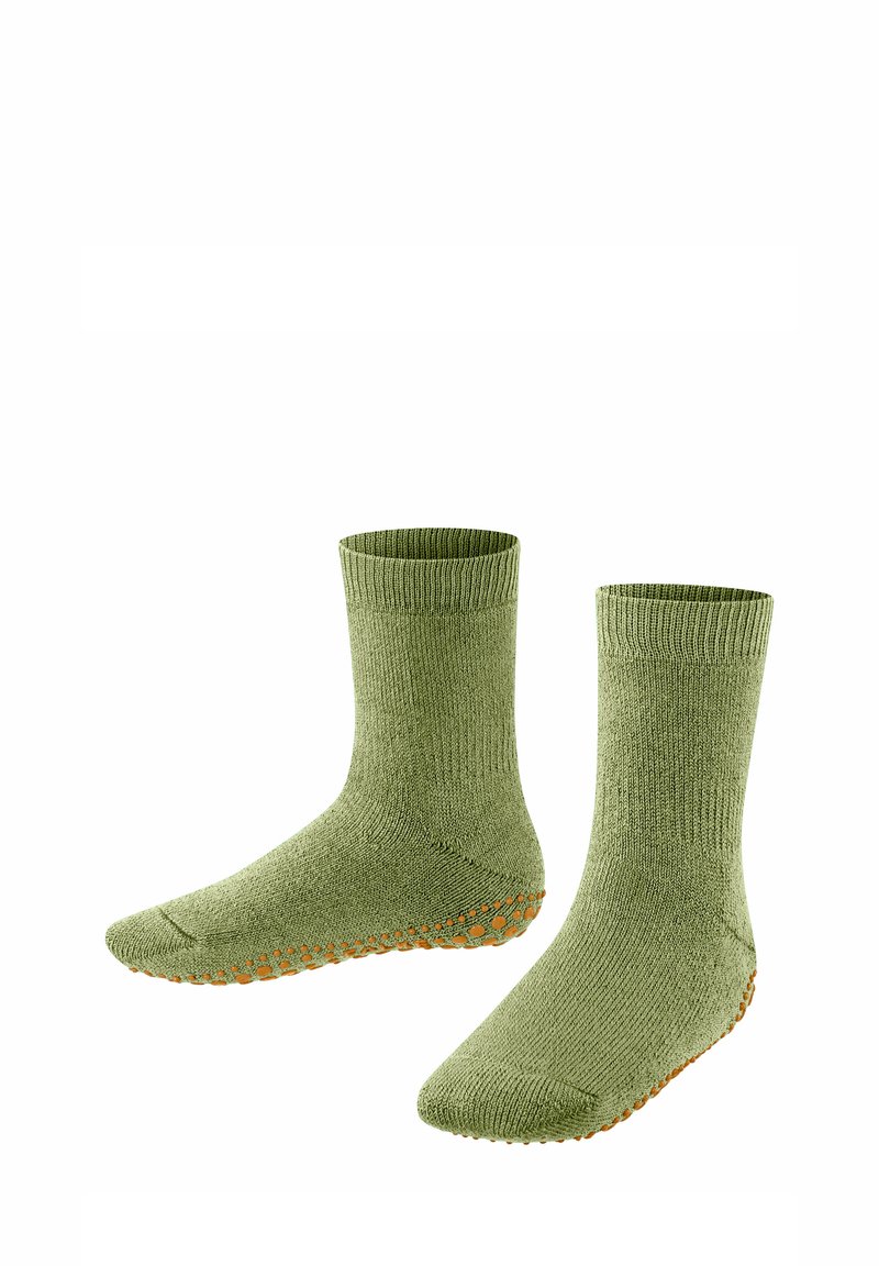 Chaussettes en laine vertes avec des bords côtelés, une surface texturée et des points de grip en silicone orange sur la semelle pour une meilleure traction.