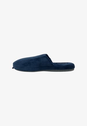 Pantofole slip-on blu navy con tomaia in tessuto morbido e strutturato e suola piatta grigia. Design minimalista con retro aperto per una facile calzata.