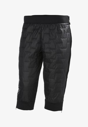 Czarne, pikowane, skrócone spodnie z wypełnieniem, z elastycznym pasem i zamykanymi na zamek bocznymi kieszeniami. Materiał jest gładki i lekki.