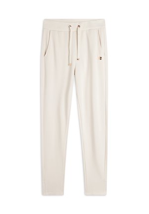 Pantaloni sportivi beige con coulisse, dotati di tasche laterali, texture liscia e un discreto logo sul cinturino.
