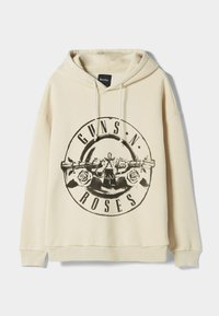 Sudadera beige hecha de tela suave, con un diseño gráfico negro que incluye "GUNS N' ROSES" y rosas. Incluye cordón ajustable y puños de canalé.