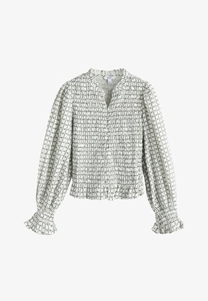 Blouse blanche à manches longues avec motif floral noir, corsage smocké, poignets et col à volants, fermeture boutonnée à l'avant, style décontracté.