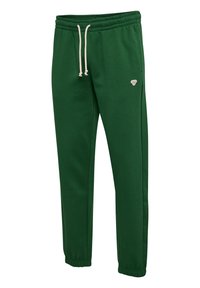 Grønne joggerbukser lavet af bomuldsblanding. Har en elastisk talje med snoretræk og ribbede manchetter. Lille logo detalje foran.