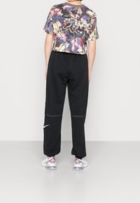 Nike Sportswear Träningsbyxor - black