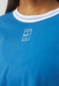 Nike Performance HERITAGE CROP TEE - Spordi T-särk - star blue