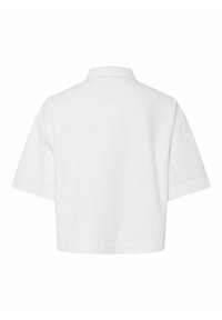 Chemise blanche courte à manches courtes avec un large col, vue de dos sur un fond blanc uni.