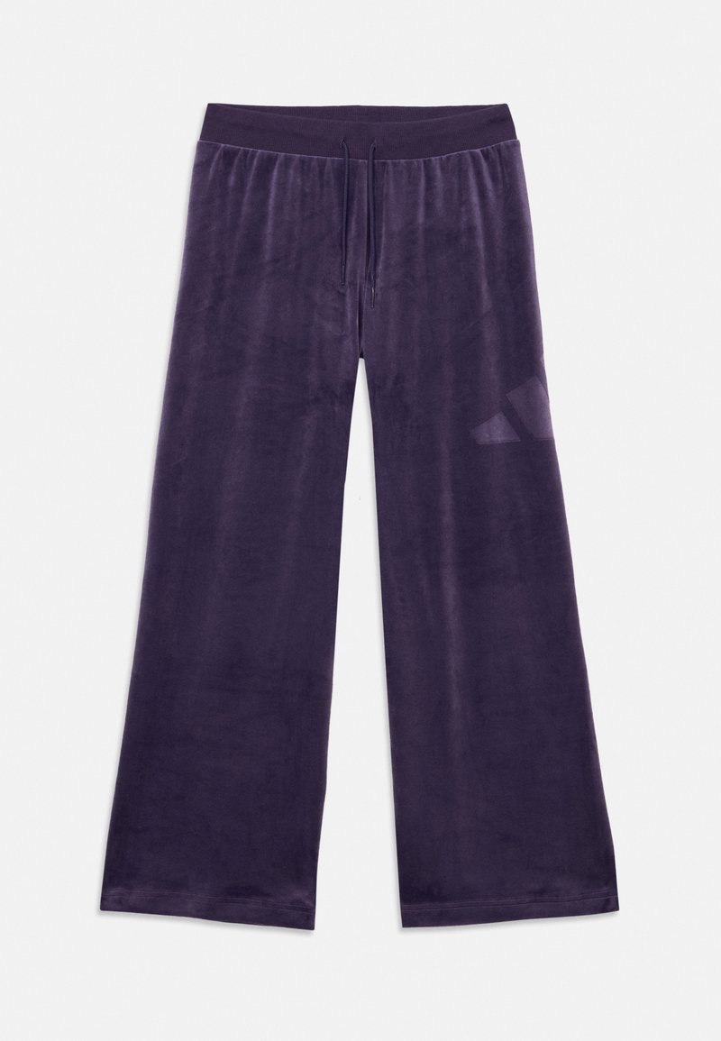 Calças largas de lounge em veludo roxo profundo, com cintura ajustável e textura suave, concebidas para conforto e liberdade de movimento.