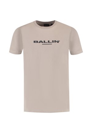 Beige short-sleeve t-shirt made of cotton, featuring the word "BALLIN'" in bold black lettering across the chest. Simple crew neck design.