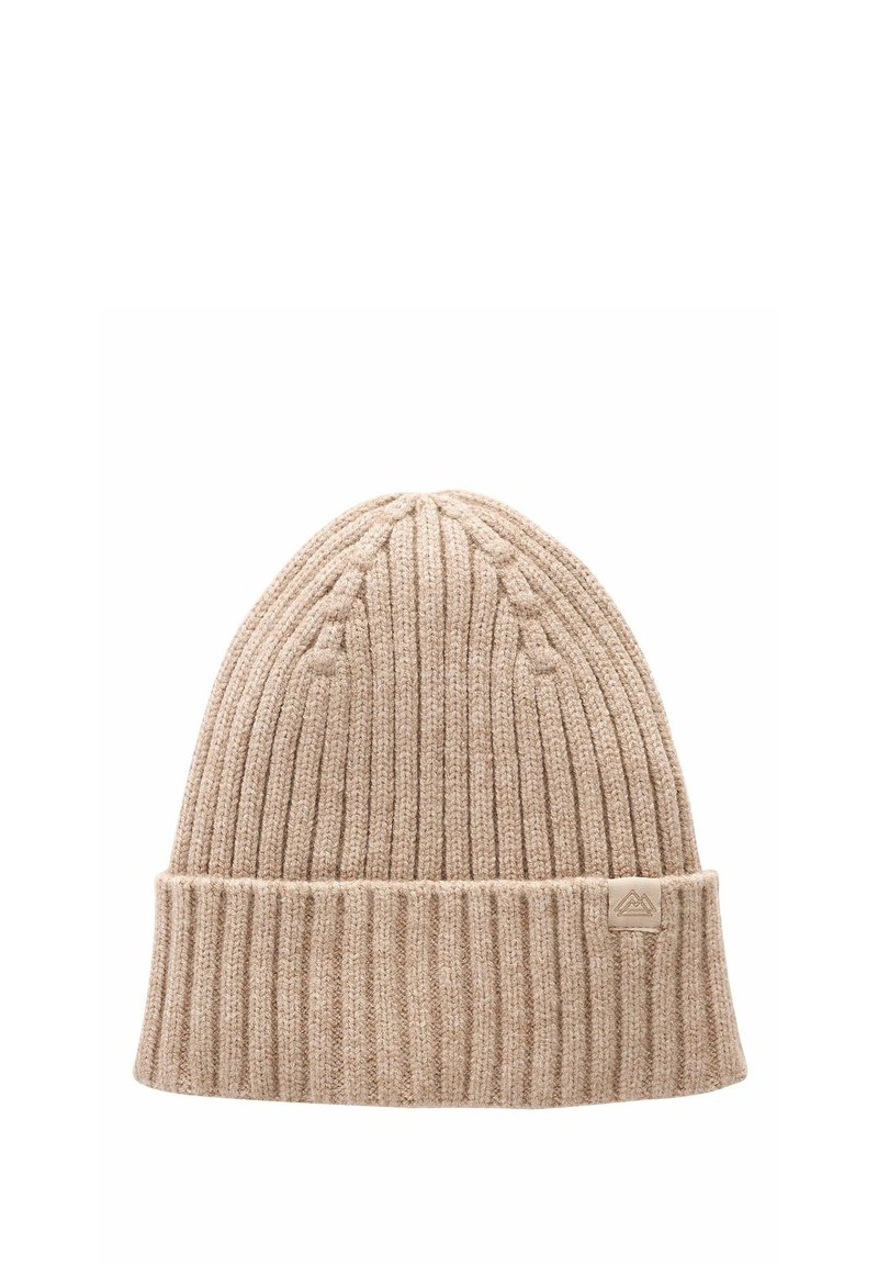 Beige knit beanie made of textured fabric, featuring a ribbed design and a folded cuff. A small logo tag is sewn onto the cuff.