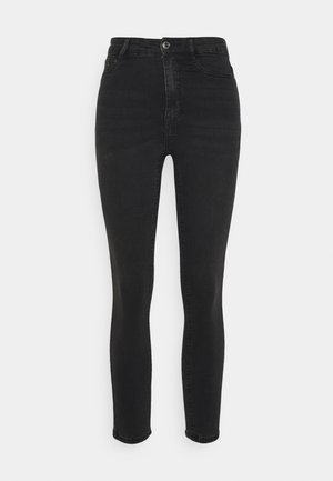 Vaqueros negros de cintura alta, hechos de denim, con cierre de botón y un diseño slim fit. Presentan un desvanecimiento mínimo y sin patrones visibles.