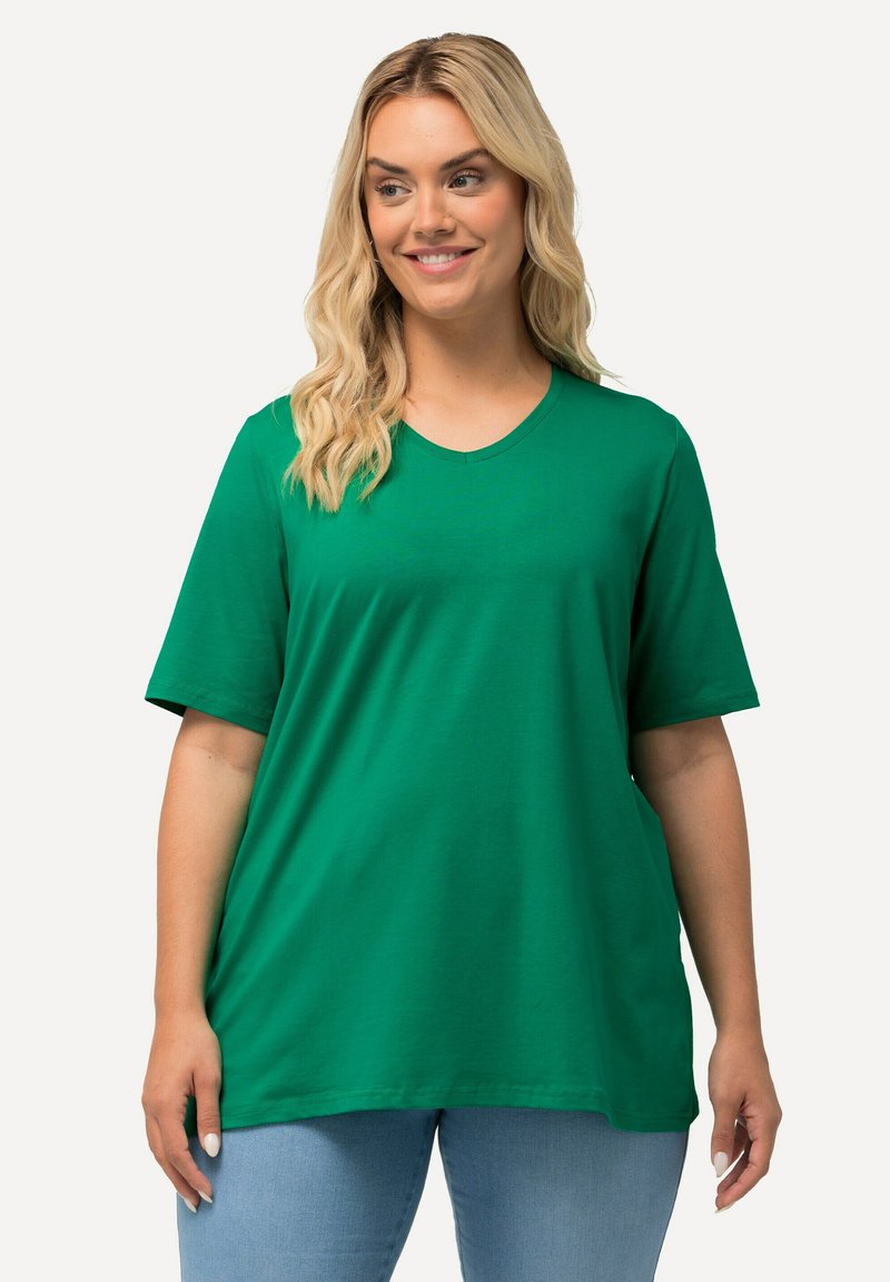 Grünes Kurzarm-T-Shirt aus weicher Baumwolle. Mit Rundhalsausschnitt, lockerer Passform und glatter Textur. Ideal für die Freizeit.