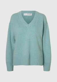 Light teal V-neck sweater made of soft material, featuring ribbed cuffs and hem, with a relaxed fit and minimalistic design.