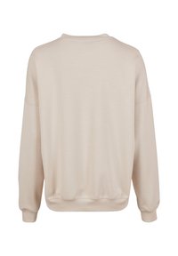 Felpa beige con vestibilità rilassata, scollatura rotonda, spalle basse e polsini e orlo a costine. Tessuto morbido e leggero.