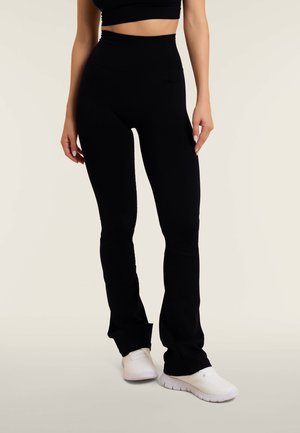 RIBBED HIGH-WAISTED FLARE SPORTS - Trikoot - black