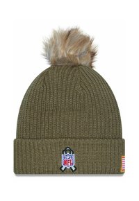 Olive green knit beanie with a faux fur pom-pom on top, featuring an embroidered NFL logo and small American flag patch on the side.