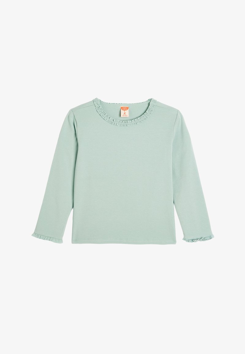 Bawełniana bluzka z długim rękawem w jasnym odcieniu miętowej zieleni, z falbaną przy dekolcie i mankietach. Prosta, gładka tekstura bez wzorów lub akcentów.