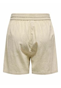 Shorts en lin beige avec une taille élastique et une coupe ample, présentant une surface légèrement texturée et sans poches. Design simple et fonctionnel.