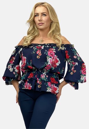 Floral off-the-shoulder blouse in navy with ruffled sleeves and gathered waist. Features pink and white roses on a dark background.