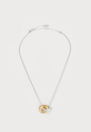 Silver chain necklace featuring intertwined metal rings, one gold and one silver, with a smooth texture and polished finish.