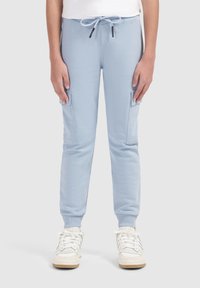 Lichtblauwe joggingsbroek van zachte stof, met zijvakken, elastische boorden en een verstelbare tailleband met trekkoord.