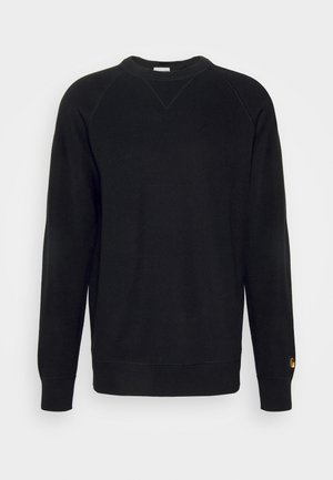 Schwarzer Pullover aus strukturiertem Stoff, runder Halsausschnitt und lange Raglanärmel. Verfügt über ein kleines, goldenes Logo am unteren Ärmel.