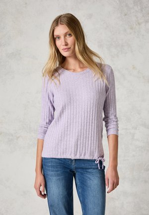 Pull en lilas clair côtelé avec un col rond, des manches longues et un cordon de serrage au niveau de l'ourlet. Fabriqué dans un tissu doux et texturé.