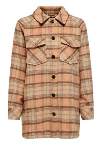 Veste en flanelle à carreaux beige, rose et marron clair avec des accents jaunes. Comprend deux poches poitrine et une fermeture à boutons sur le devant.