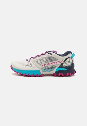 Trail running shoes with a white mesh upper, teal accents, pink soles, and black heel support; features textured grip and reflective details.