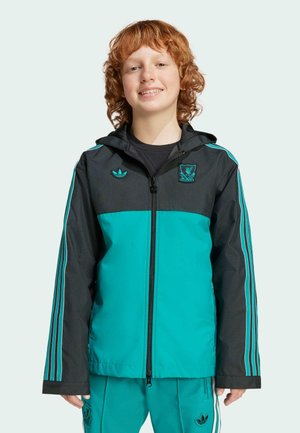 Türkise und schwarze Kapuzenjacke mit Reißverschluss, ausgestattet mit einem Dreistreifen-Design an den Ärmeln und gestickten Logos auf der Brust und der Schulter.
