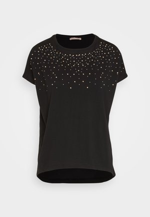 Black t-shirt with short sleeves, featuring a gradient of metallic gold and silver studs near the neckline, soft fabric, and rounded hem.