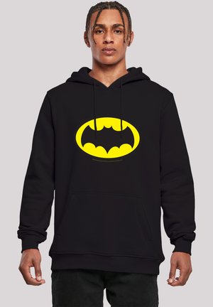 Black hoodie featuring a large yellow Batman logo on the front. Constructed from a soft fabric with a kangaroo pocket and adjustable drawstrings.