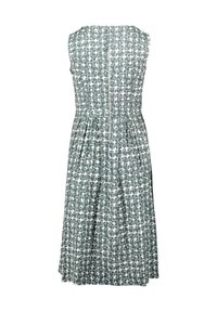 Ärmelloses Kleid mit einem grünen und weißen geometrischen Muster, taillierter Oberteil und ausgestellt Rock, mit Reißverschluss hinten.