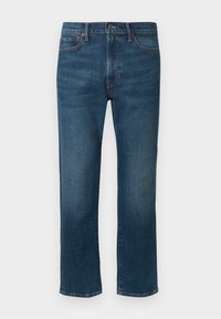 Mørkeblå denimjeans med rett snitt, som har fem lommer og diskret oransjefarget søm. Materialet har en lett teksturert overflate.