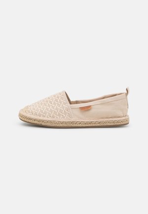 Beige canvas espadrille with woven pattern on the toe, jute rope sole, and a small leather logo accent on the side.