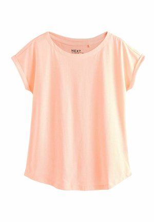 Tricou din bumbac de culoare piersiciu, cu guler rotund și mâneci scurte rulate, având o croială lejeră și o textură netedă.
