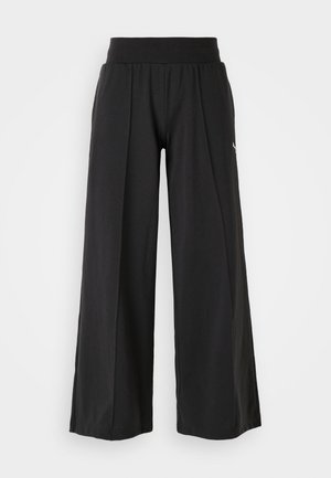 Black wide-leg pants with a textured fabric, elastic waistband, and PUMA logo accent. Simple design with a casual fit.