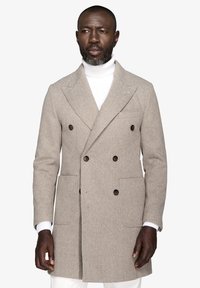 Hørfransk mønstrede frakk i beige, dobbeltradet design med brune knapper, sidelommer og en skræddersyet pasform. Tekstureret uldmateriale.