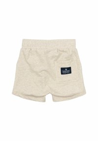 Ljusbeige bomullsshorts med elastisk midja och en bakficka med en blå etikett. Mjuk textur, avslappnad design.