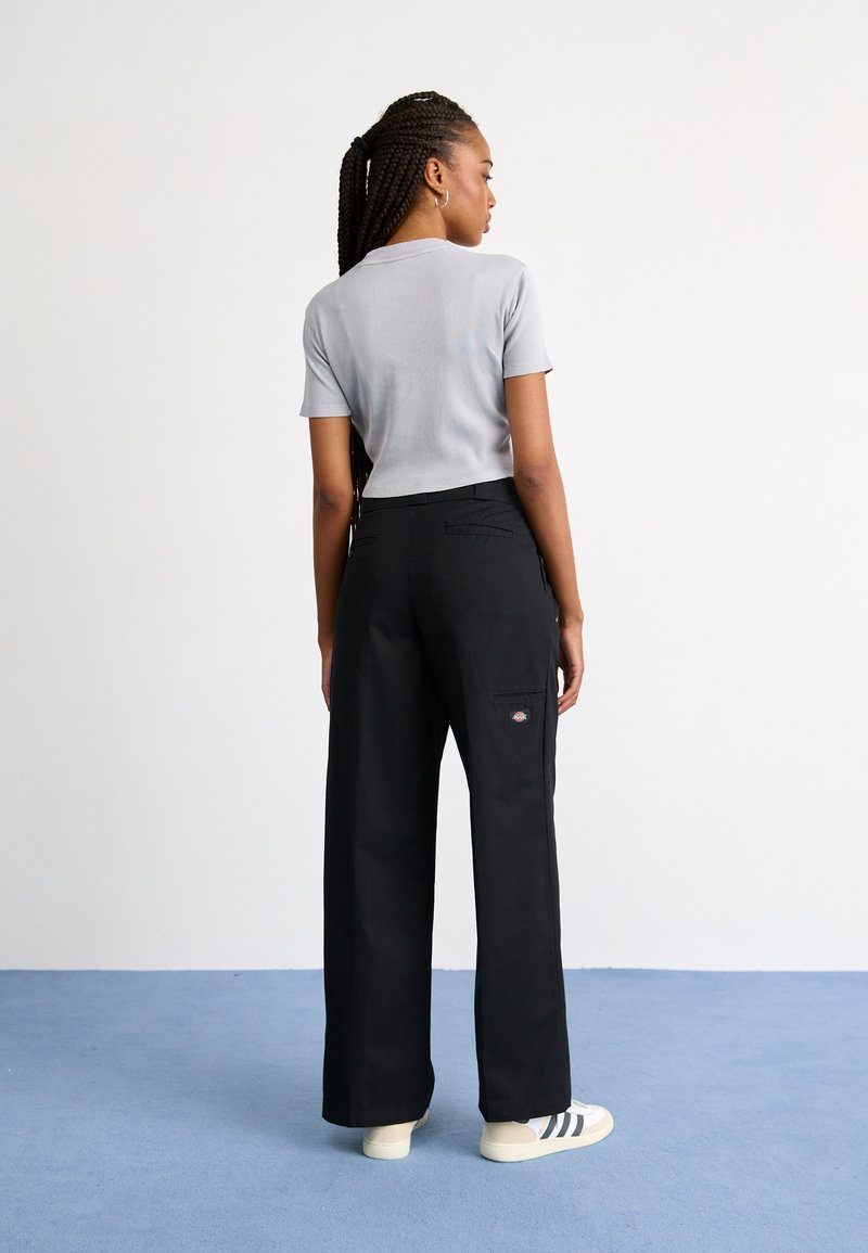DISBACANAL Pantalon Disco Adulte Noir Taille M - Costume Années 70