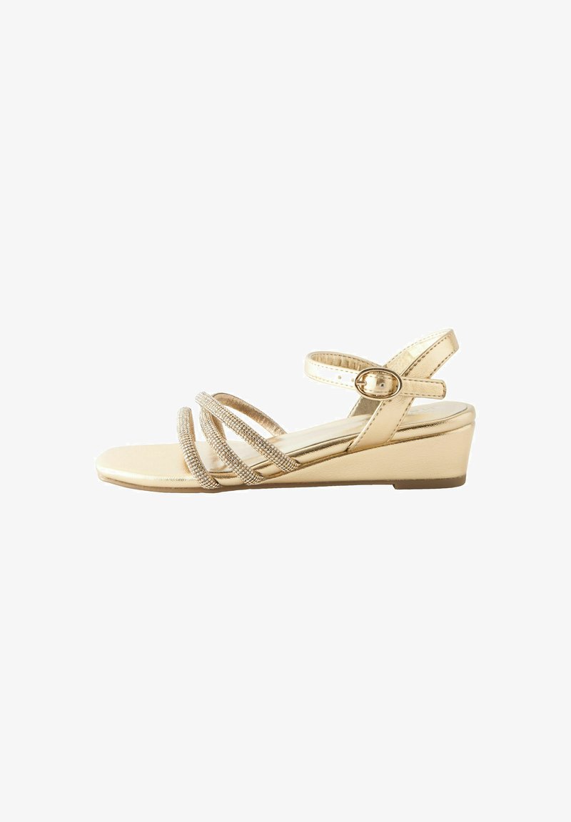 Gold wedge sandals with multiple metallic straps, textured with small rhinestones; features a buckle fastening and a flat sole.