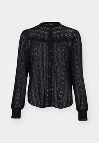 Blouse à manches longues en dentelle noire avec des motifs floraux complexes, fermeture à boutons et col mandarin avec poignets ajustés.