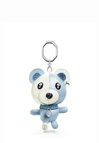 Porte-clés ours en cuir bleu et blanc avec yeux noirs, ornements en cristal et ferrures argentées. Présente des détails cousus et un pendentif.