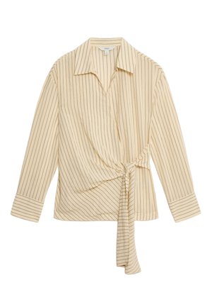 Cremefarvet skjorte med knapper foran, vertikale mørke striber, lange ærmer, krave og en bundet detalje foran. Blødt stof, afslappet pasform og strukturerede manchetter.