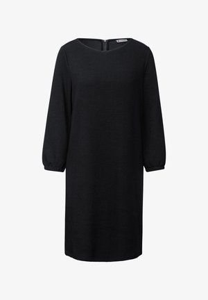 Robe noire en tricot avec des manches longues légèrement bouffantes, un col rond et une fermeture éclair invisible dans le dos. Texture lisse, longueur au genou.