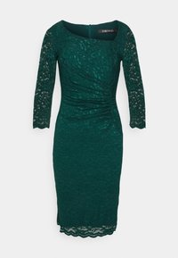 Robe en dentelle teal à manches trois-quarts, corps froncé, encolure ronde et ourlet festonné. Fermeture à glissière au dos, intérieur doublé.